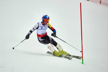 BRASOV, ROMANIA -13 February 2018: Young competitors in Romania Teleferic CUP Junior alpine Ski 2 edition in Poiana Brasov, Romania
