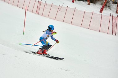 BRASOV, ROMANIA -13 February 2018: Young competitors in Romania Teleferic CUP Junior alpine Ski 2 edition in Poiana Brasov, Romania