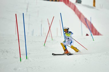 BRASOV, ROMANIA -13 February 2018: Young competitors in Romania Teleferic CUP Junior alpine Ski 2 edition in Poiana Brasov, Romania
