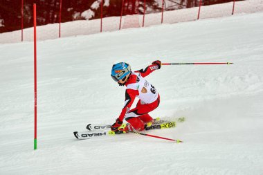 BRASOV, ROMANIA -13 February 2018: Young competitors in Romania Teleferic CUP Junior alpine Ski 2 edition in Poiana Brasov, Romania
