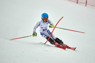 BRASOV, ROMANIA -13 February 2018: Young competitors in Romania Teleferic CUP Junior alpine Ski 2 edition in Poiana Brasov, Romania