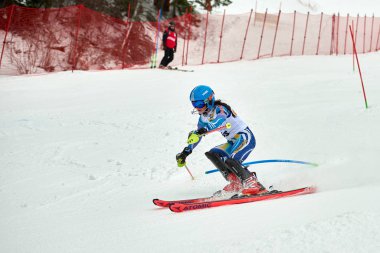 BRASOV, ROMANIA -13 February 2018: Young competitors in Romania Teleferic CUP Junior alpine Ski 2 edition in Poiana Brasov, Romania
