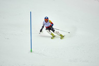 BRASOV, ROMANIA -13 February 2018: Young competitors in Romania Teleferic CUP Junior alpine Ski 2 edition in Poiana Brasov, Romania