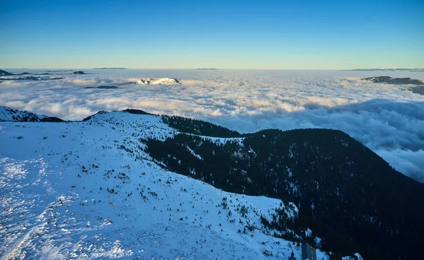 Amazing Landscape view from Ceahlau Mountains with Sea of clouds in winter season, Aerial winter Landscape in National Park