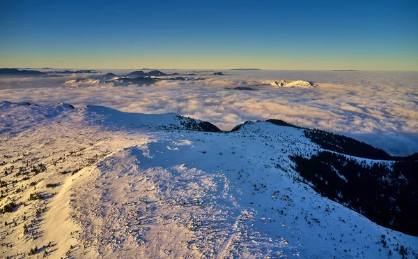 Amazing Landscape view from Ceahlau Mountains with Sea of clouds in winter season, Aerial winter Landscape in National Park