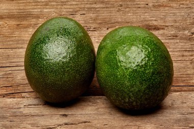 avocado on a old wood background. tinting. selective focus clipart