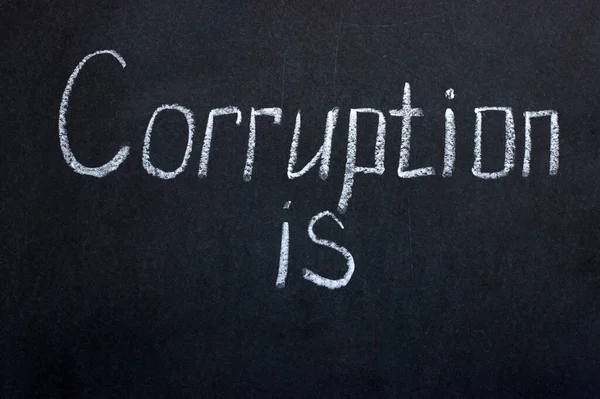 The writing on the chalkboard Corruption is. It is possible to continue the phrase