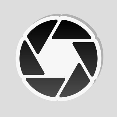 Kamera objektif. basit siluet. Etiket tarzı ile beyaz ve gri arka plan üzerinde basit gölge