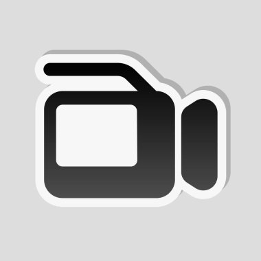 Video kamera ile perde. Etiket tarzı ile beyaz ve gri arka plan üzerinde basit gölge