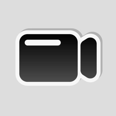 Basit video kamera simgesi. Etiket tarzı ile beyaz ve gri arka plan üzerinde basit gölge