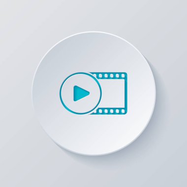 Film şeridi daire içinde oyun simgesiyle. basit siluet. Gri ve mavi katmanları ile daire kes. Kağıt tarzı