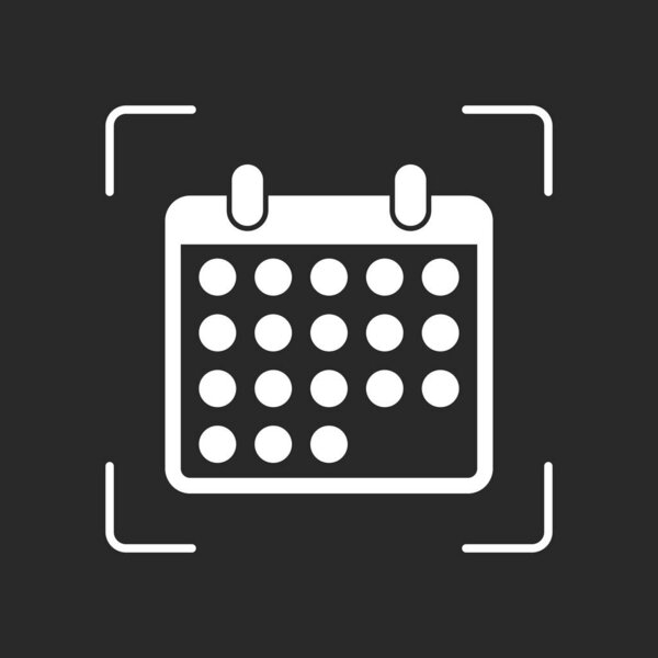 simple calendar icon. White object in camera autofocus on dark background