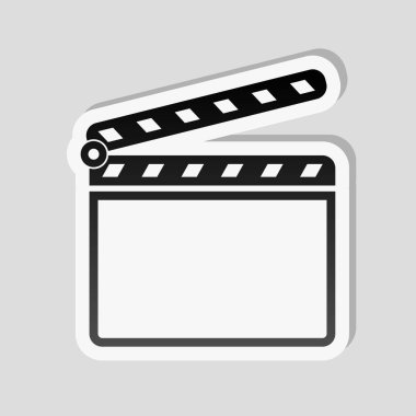 Film bel soğukluğu kurulu sinema açık simgesi. Etiket tarzı ile beyaz ve gri arka plan üzerinde basit gölge