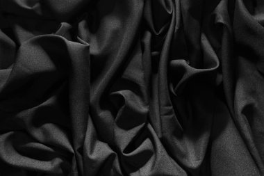 Kırışmış gri kumaş, aydınlık vuruşlar, karanlık desen arka plan.