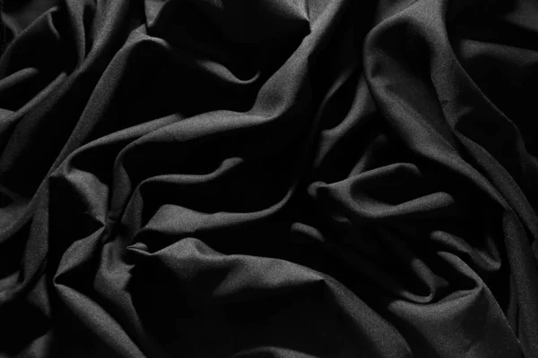 Tecido cinza enrugado, hits de luz, fundo padrão escuro . — Fotografia de Stock