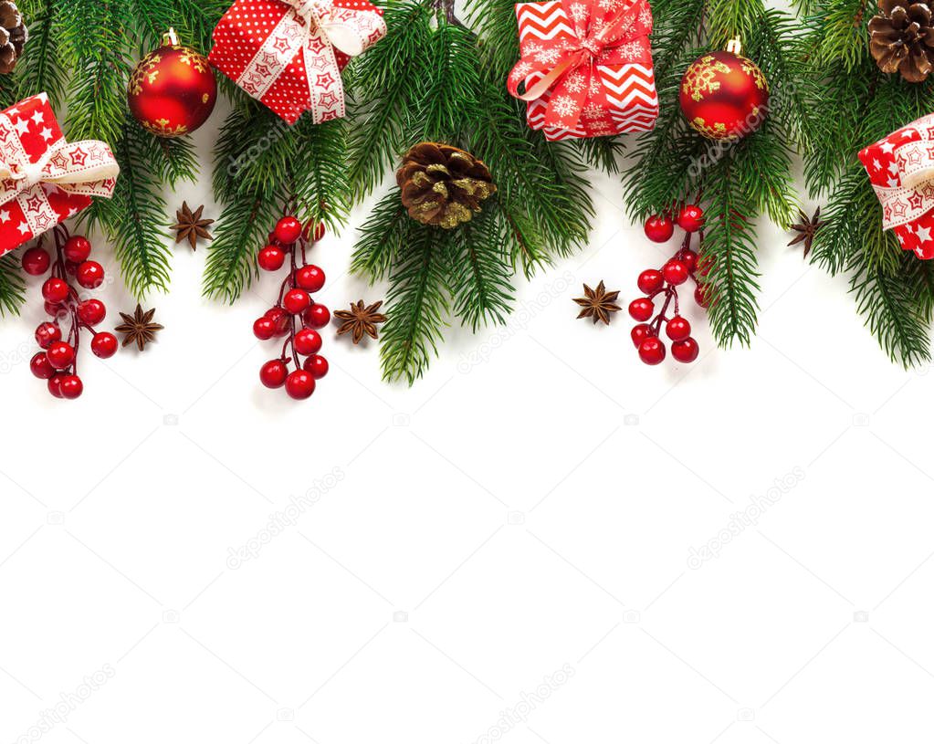 Christmas tree branches with decoration isolated on white background.