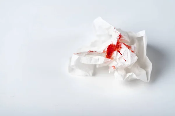 A photo of used bloody toilet paper on the light blue background — Stock Photo, Image