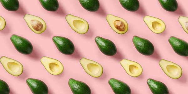 Avocado patroon op roze achtergrond. Pop Art Design, creatieve zomer voedsel concept. Groene avocadoes, minimale platte lay stijl. Top View — Stockfoto