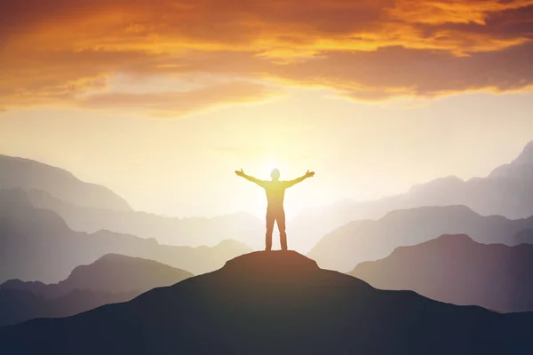 Climber arms up outstretched on mountain top looking at inspirational landscape. — Stock Photo, Image