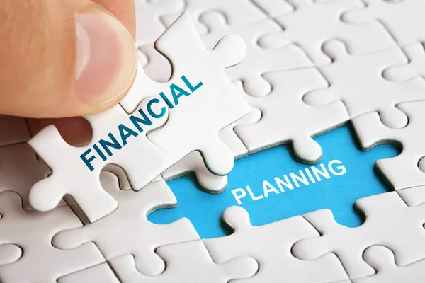 Hand holding piece of puzzle with words Financial Planning. — Stock Photo, Image