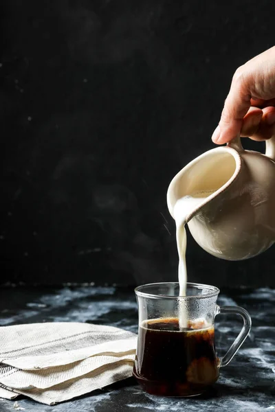 Woman Hand Pouring Milk Glass Cup Coffee — Stock Photo, Image