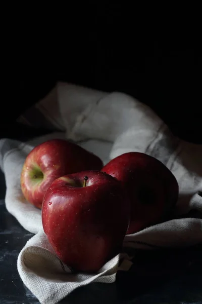 Red apples on a black background,still life apples