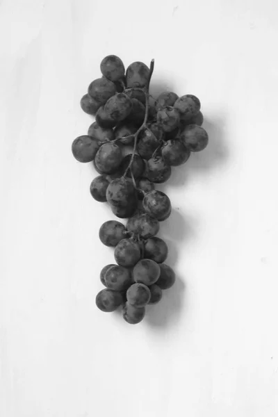 Grape fruits on a white background, black and white shot