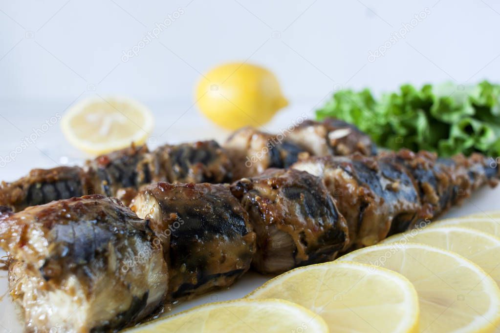 Slices of mackerel in soy-mustard sauce baked on the grill