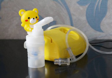 Nebulizer for the treatment of respiratory diseases. Inhalation. clipart