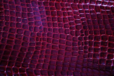 The texture of red oilcloth. Crocodile skin. Saturated red polyethylene. clipart