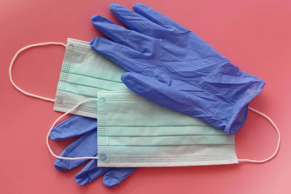 Disposable medical mask and latex gloves. Medical kit essential disposable items.