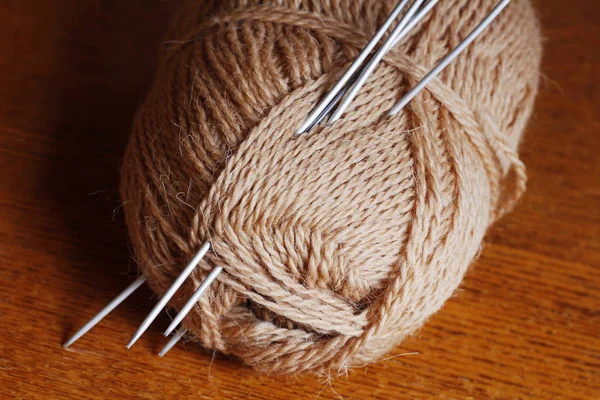 Skein thread and knitting needles. Knit. Needlework.