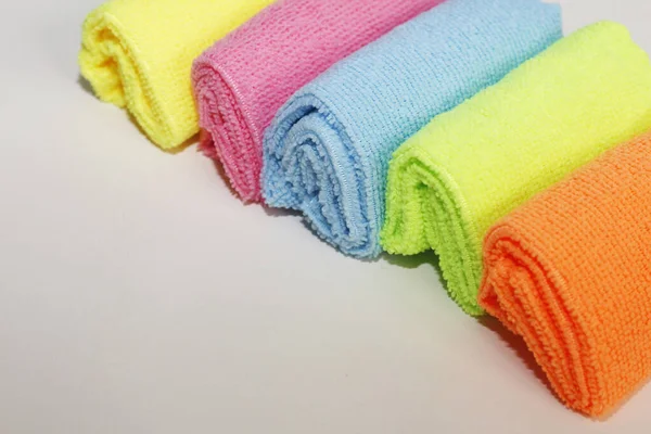 A set of multi-colored microfiber cloths for cleaning. Cleaning services. Cleaning of premises. Housekeeper. A set of bright microfiber napkins for home cleaning.