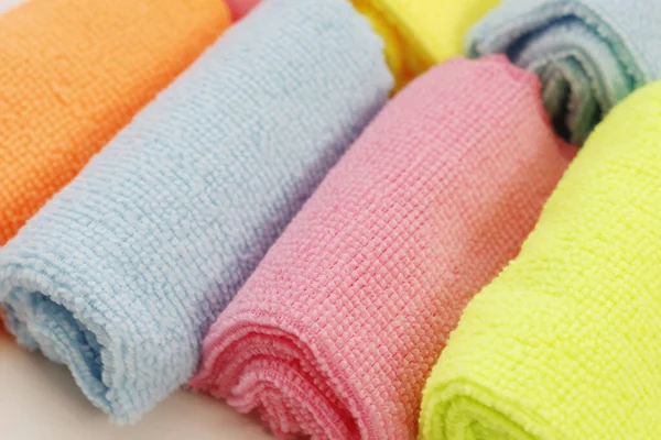 A set of multi-colored microfiber cloths for cleaning. Cleaning services. Cleaning of premises. Housekeeper. A set of bright microfiber napkins for home cleaning.