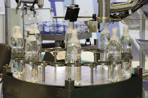 Liquid nitrogen batcher. Liquid nitrogen supply system for plastic bottles. Conveyor at the enterprise. Factory, production.