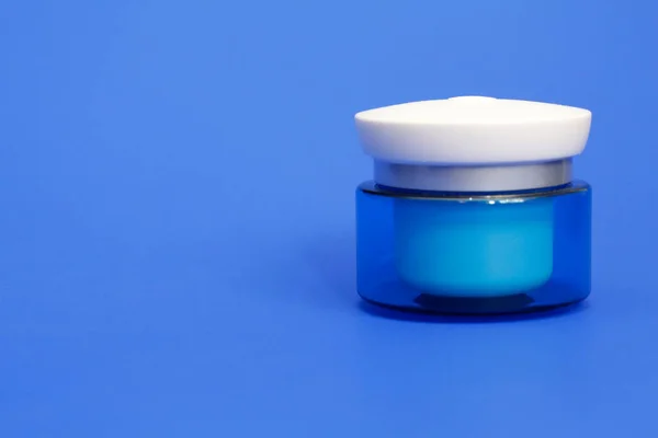 Blue Jar Cosmetic Cream Blue Background Body Lotion Jar Moisturizing — Stock Photo, Image