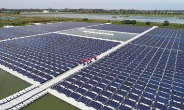 Aerial view of a floating solar energy farm at a photovoltaic power station in Qinlan town, Tianchang city, east China's Anhui province, 15 October 2018. clipart