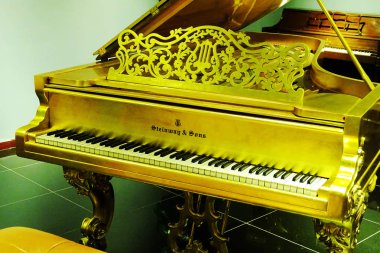 piano of Steinway & Sons, the US-German high-end piano maker, is displayed at the Wuhan Qintai Piano Museum in Wuhan city, central China's Hubei province, 17 June 2017 clipart