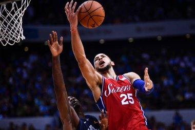 Ben Simmons of Philadelphia 76ers jumps for a rebound against Dallas Mavericks during the Shenzhen match of the NBA China Games in Shenzhen city, south China's Guangdong province, 8 October 2018 clipart