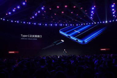 Chang Cheng, Vice President of Lenovo and CEO of ZUK Mobile, a subsidiary of Lenovo, introduces the Lenovo S5 Pro smartphone featuring a quad-camera setup at the rear and other new products at the launch event in Beijing, China, 18 October 2018 clipart