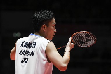 Kento Momota of Japan reacts while competing against Shu Yuqi of China in their Men's Singles final match during the HSBC BWF World Tour Finals 2018 in Guangzhou city, south China's Guangdong province, 16 December 2018 clipart