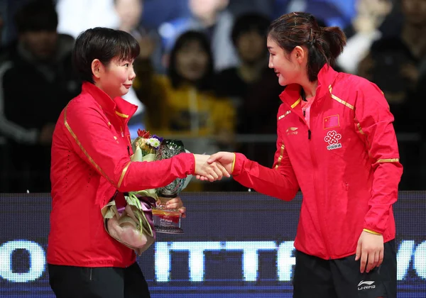 He Zhuojia, left, of China shakes hands with Chen Meng of China after their women\'s singles final match during the Seamaster 2018 ITTF World Tour Grand Finals in Incheon, South Korea, 16 December 2018