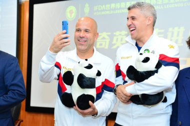 Italian football manager and former football player Luigi Di Biagio, left, and former French football player Hernan Crespo attend an event at Chengdu Sport University in Chengdu city, southwest China's Sichuan province, 14 December 2018. clipart