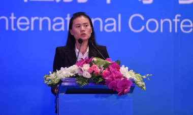 --FILE--Lucy Peng Lei, the executive chairman of Ant Financial Services, the online finance arm of Alibaba Group, speaks at a conference in Hangzhou city, east China's Zhejiang province, 22 October 2015 clipart