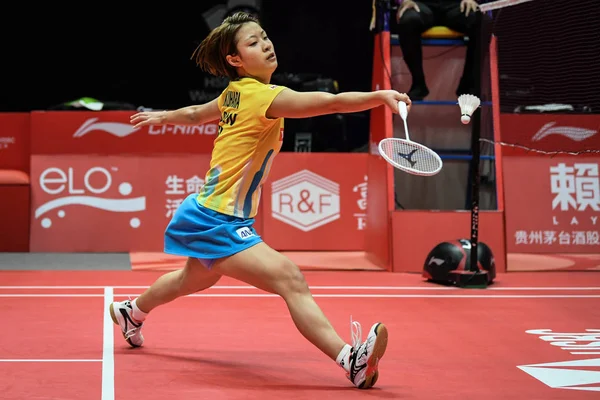 stock image Nozomi Okuhara of Japan returns a shot to Michelle Li of Canada in their Women's Singles Group A match during the HSBC BWF World Tour Finals 2018 in Guangzhou city, south China's Guangdong province, 12 December 2018