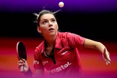 Szocs Bernadette of Romania serves against Doo Hoi Kem of Hong Kong in their Women's Singles eighth-final match during the Uncle Pop 2018 ITTF Women's World Cup in Chengdu city, southwest China's Sichuan province, 29 September 2018 clipart