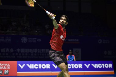 Srikanth Kidambi of India returns a shot to Kento Momota of Japan in their quarterfinal match of the men's singles during the VICTOR China Open 2018 in Changzhou city, east China's Jiangsu province, 21 September 2018 clipart
