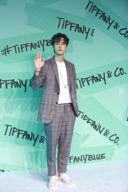 Chinese actor and singer Wang Yibo of South Korean-Chinese boyband Uniq attends a promotional event for Tiffany & Co in Shanghai, China, 6 September 2018. clipart