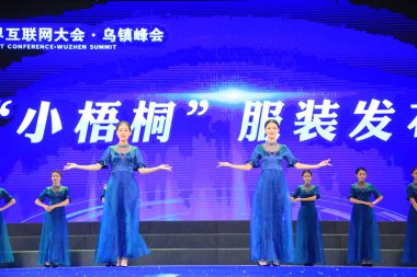 Chinese hostesses attend the launching ceremony for the Fifth World Internet Conference (WIC), also known as Wuzhen Summit, in Wuzhen town, Tongxiang, Jiaxing city, east China's Zhejiang province, 1 November 2018 clipart
