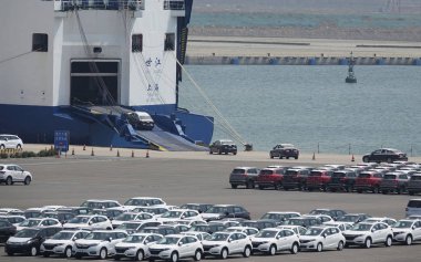 --FILE--Vehicles to be exported are lined up at a port in Dalian city, northeast China's Liaoning province, 5 May 2018 clipart